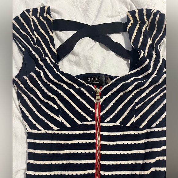 Guess mini dress with cross back detail and zipper in the front. Fair condition. - Picture 3 of 4
